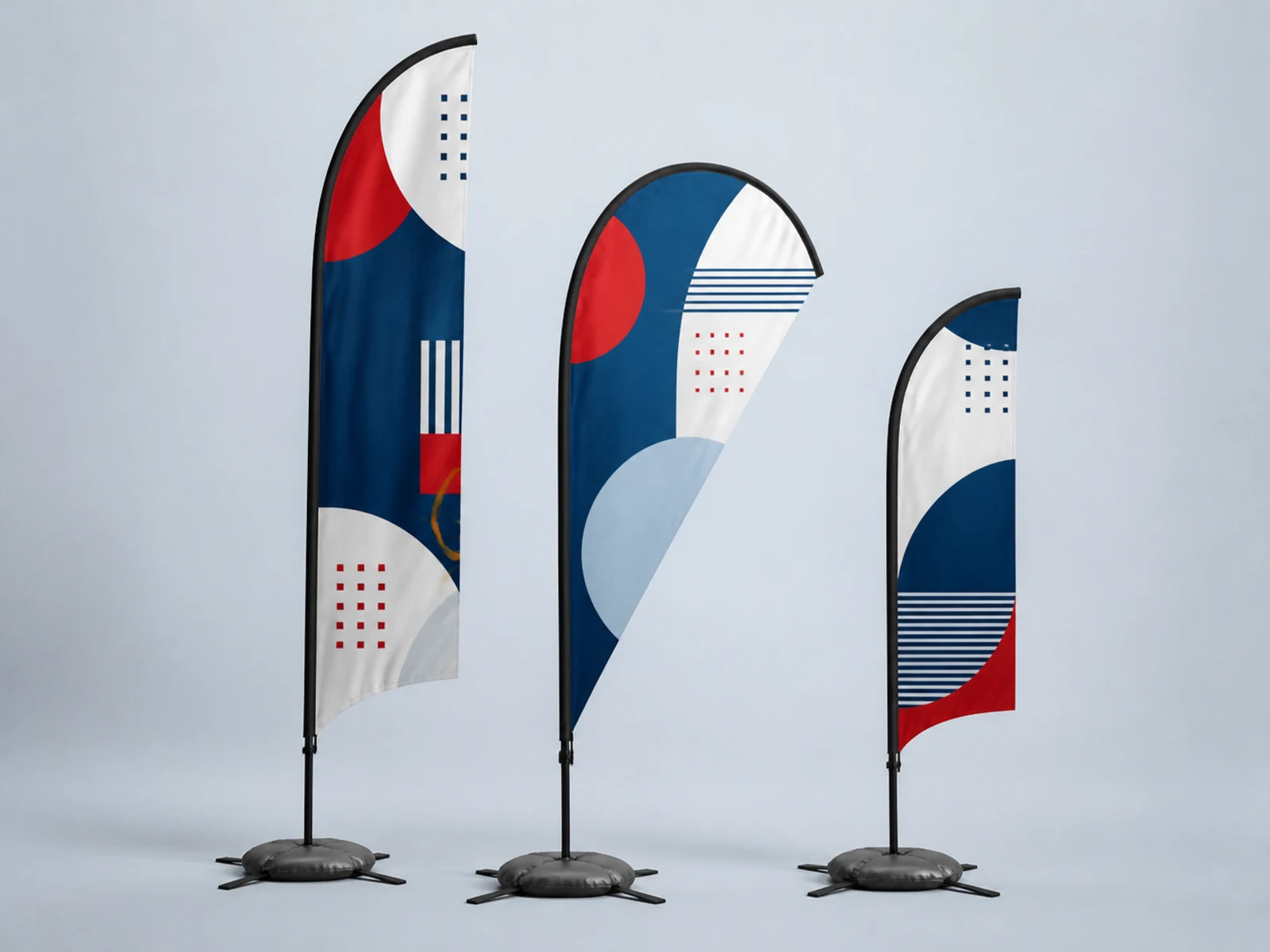 A tall feather flag, a teardrop flag, and a compact feather flag on bases